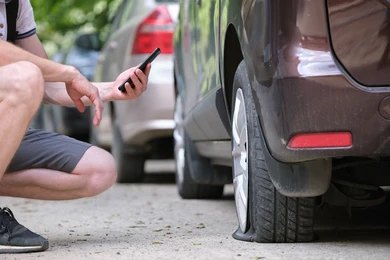 a man calling emergency mobile tyre fitting services in bathgate